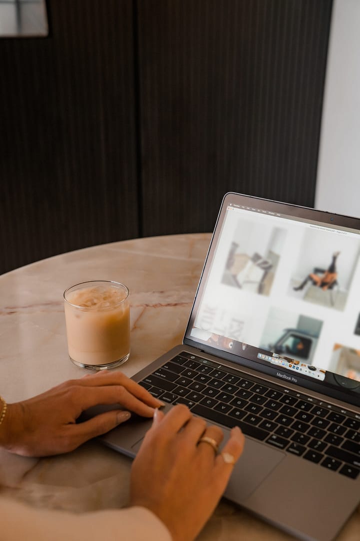 woman typing on laptop