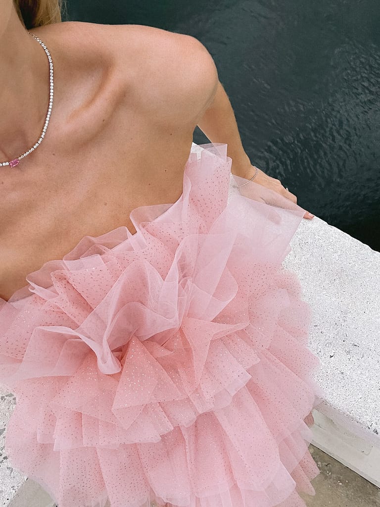 a woman wearing a puffy dress