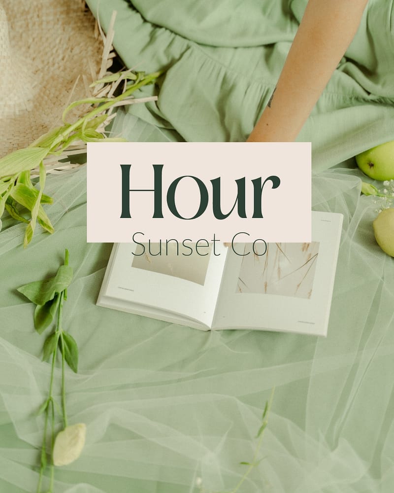 a book and fruit on a bed with a logo layered on top that says Hour Sunset Co